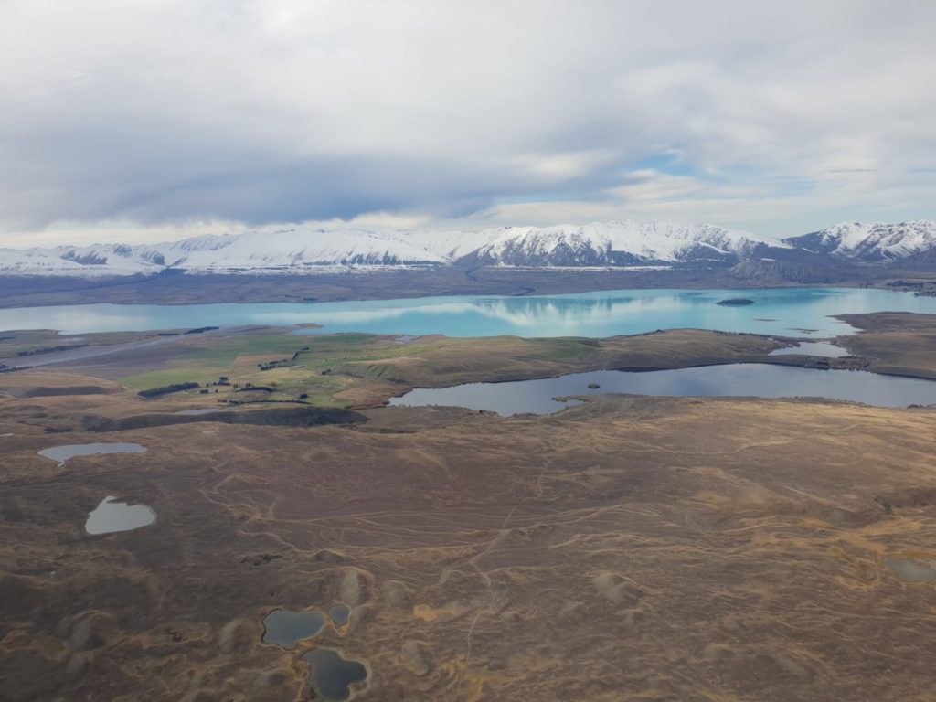 Mountains covered with snow and blue lake in New Zealand