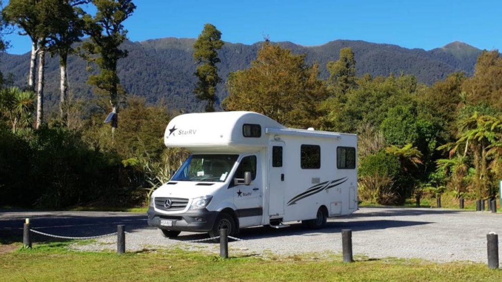 motorhome in the middle of the forrest in New zealand.