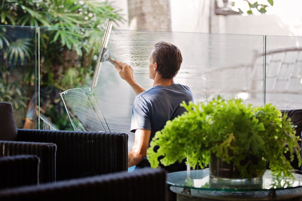 Man cleaning windows in a bar in Melbourne in Australia