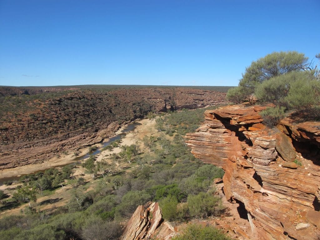 Kalbarri National Park gorge with vegetation and blue sky.